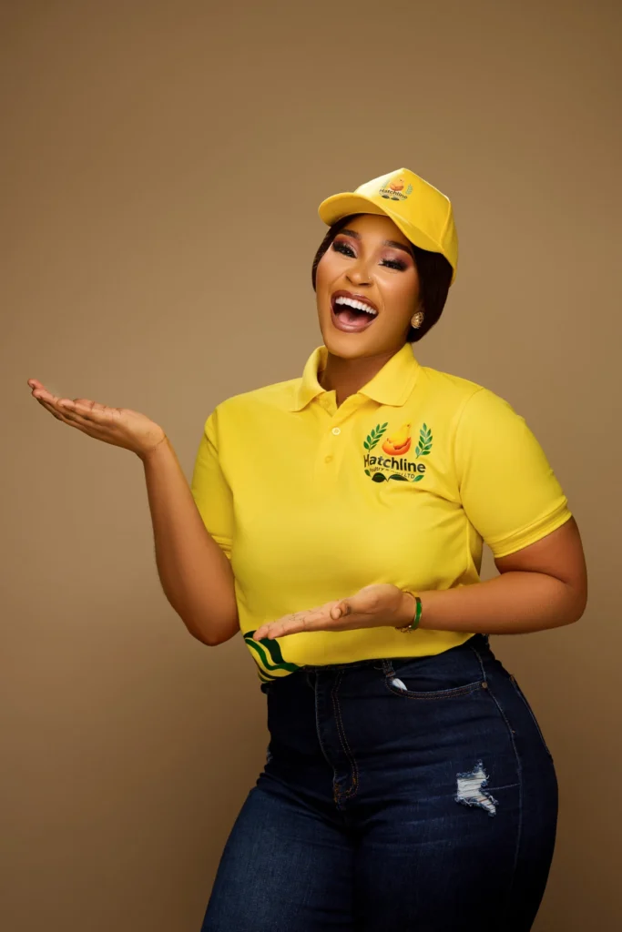 Hatchline ambassador in a yellow branded polo and cap, welcoming farmers in a warm studio setting